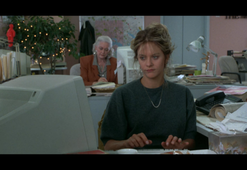 ©TriStar Pictures 1993 — Annie played by Meg Ryan typing in a computer